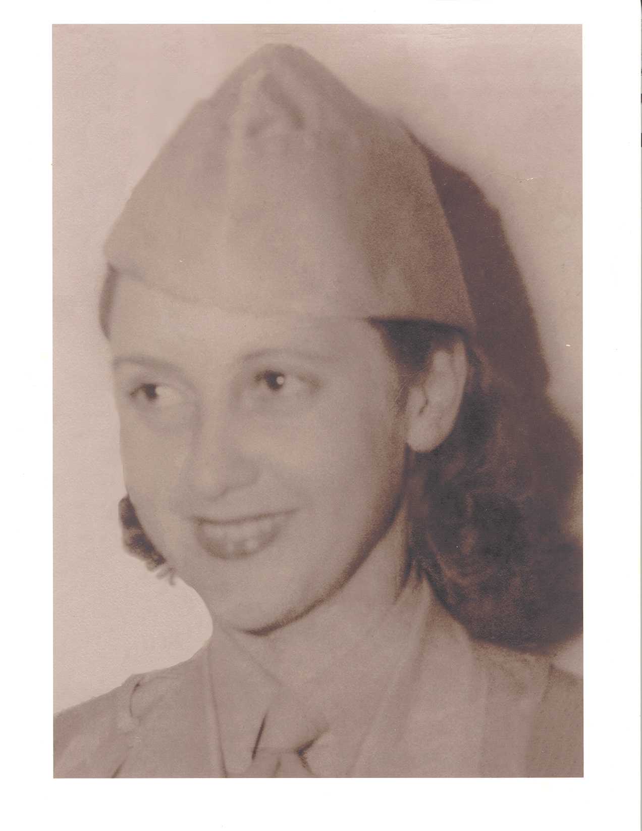 Young Betty McIntosh in military hat WWII