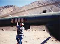 Image of a man painting the Mi-17 Helicopter.